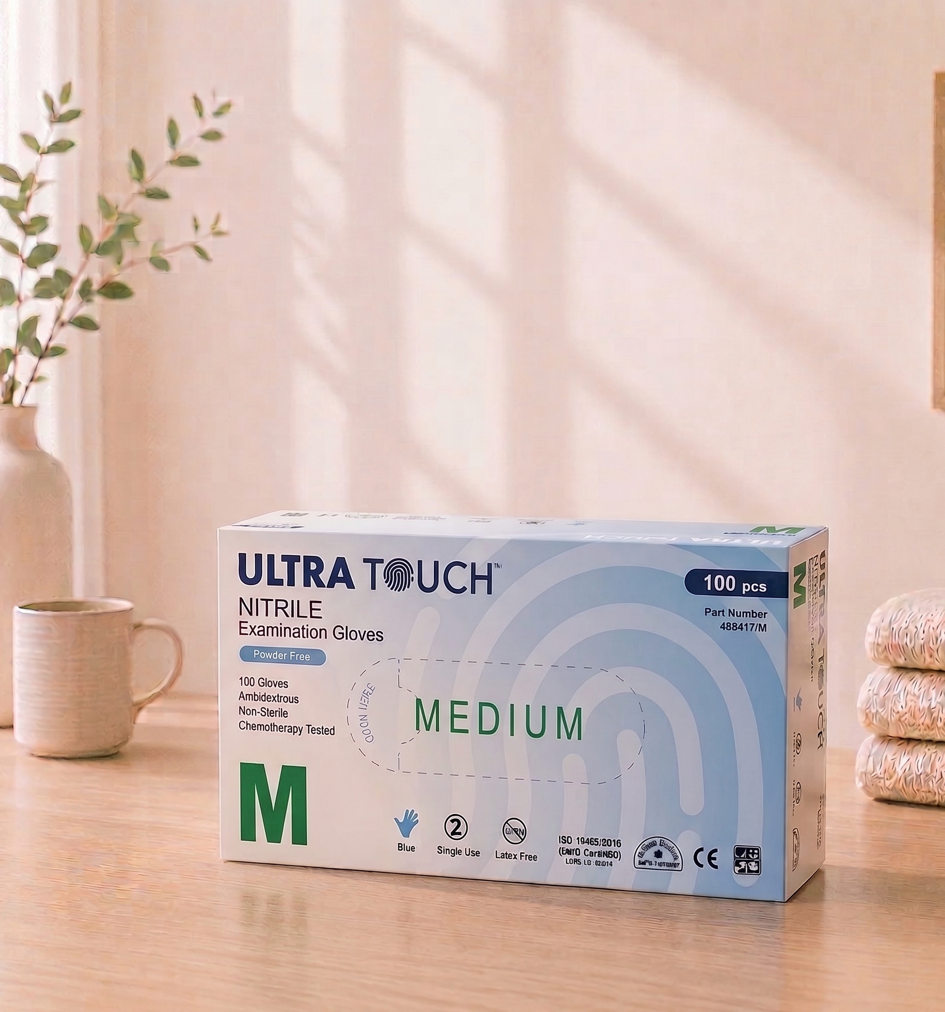 Box of Ultra Touch nitrile examination gloves on a table with a light background

