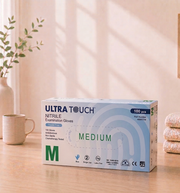 Box of Ultra Touch nitrile examination gloves on a table with a light background

