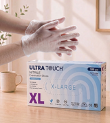 Box of Ultra Touch Nitrile Examination Gloves with a person putting on gloves in the background.

